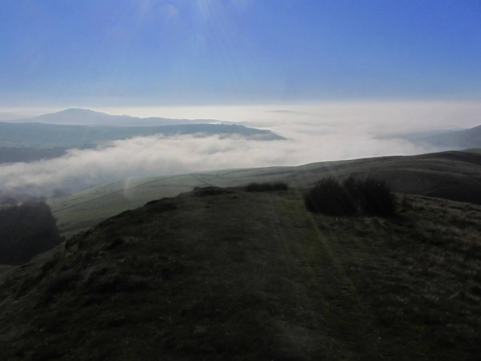 15-1407 021115 On the summit of Shutlingsloe with view towards valley fog over Wildboarclough and the Staffordshire Roaches beyond