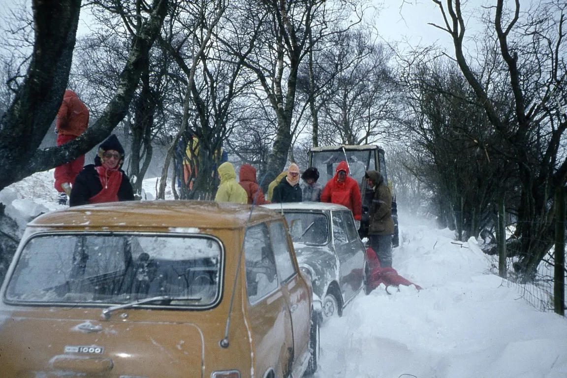 Help arrives. A farmer with his tractor to pull each car up the driveway to the A470.