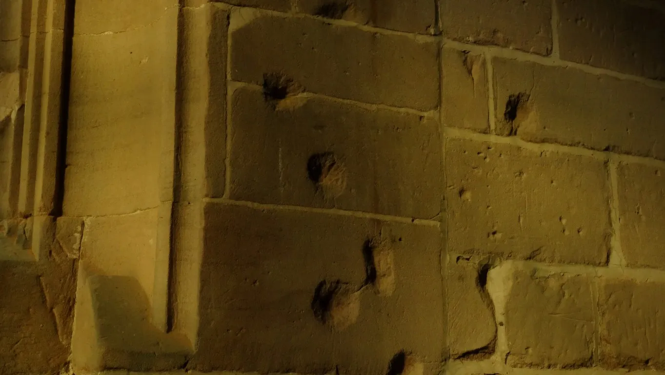 Civil War musket shot damage on the interior of St Chad's Church, Holt.