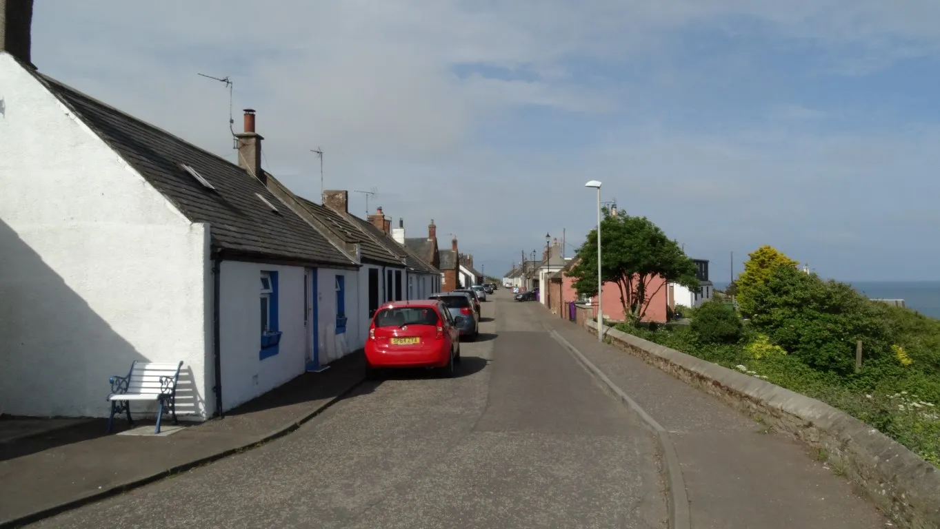 Sunshine at last. The village street in Auchmithie and very typical of a east of Scotland coastal village.